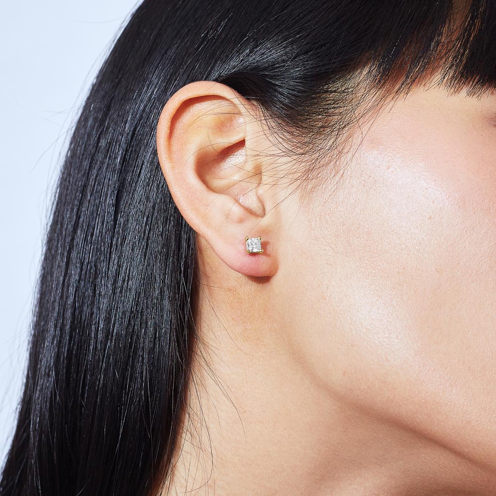 Model wearing Jewellers District's Asscher-Cut Diamond Stud Earrings in 14k Yellow Gold, Lab-grown 1.40 ctw, VS2+/ F+ #6