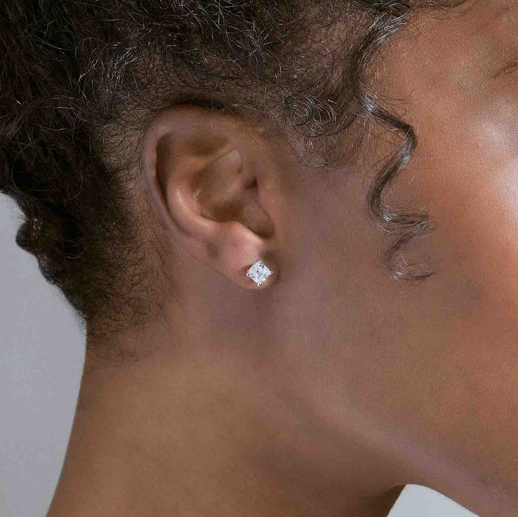 Model wearing Jewellers District's Asscher-Cut Diamond Stud Earrings in 14k White Gold, Lab-grown 1.40 ctw, VS2+/ F+ #3