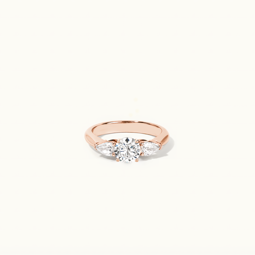 Jewellers District's Three-Stone Diamond Engagement Ring with Side Pear Diamonds in 14k Rose Gold, Round