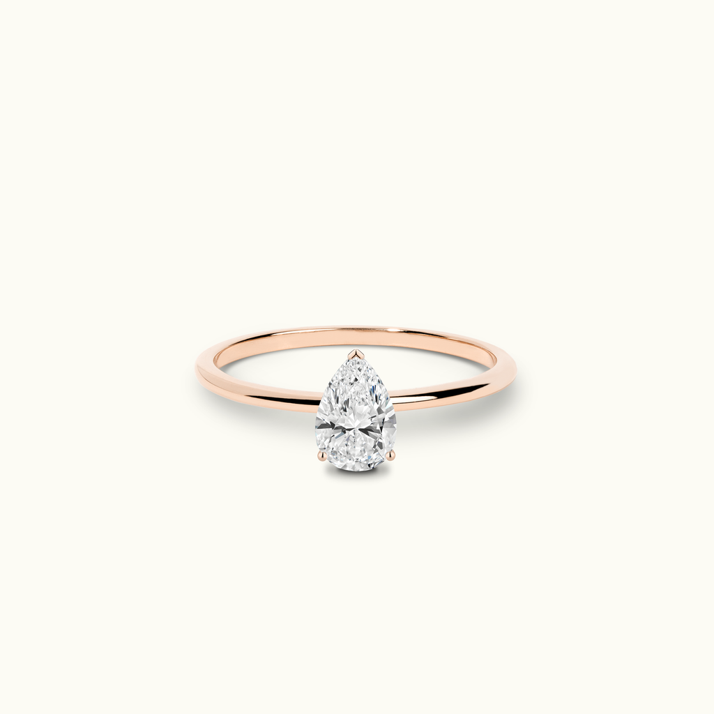 Jewellers District's Solitaire Diamond Engagement Ring with X Setting in 14k Rose Gold, Pear