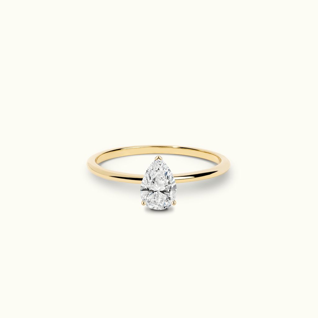 Jewellers District's Solitaire Diamond Engagement Ring with X Setting in 14k Yellow Gold, Pear