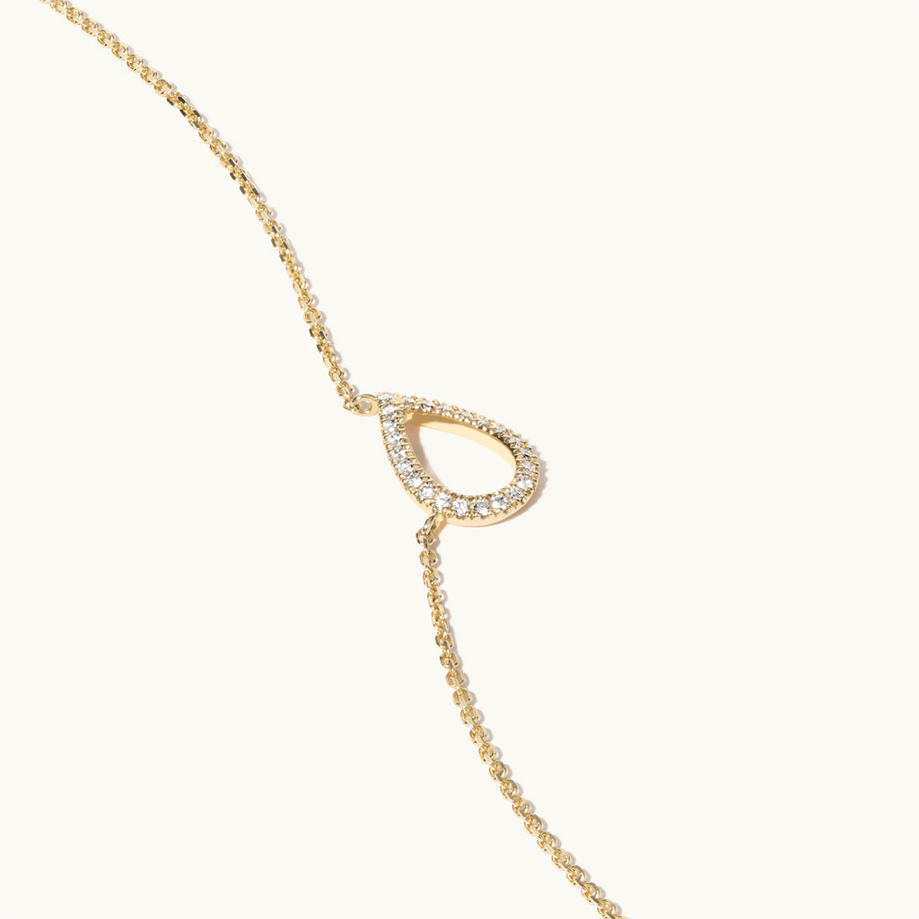 Angled view of Jewellers District's Pear Diamond Pavé Pendant Necklace in 10k Yellow Gold