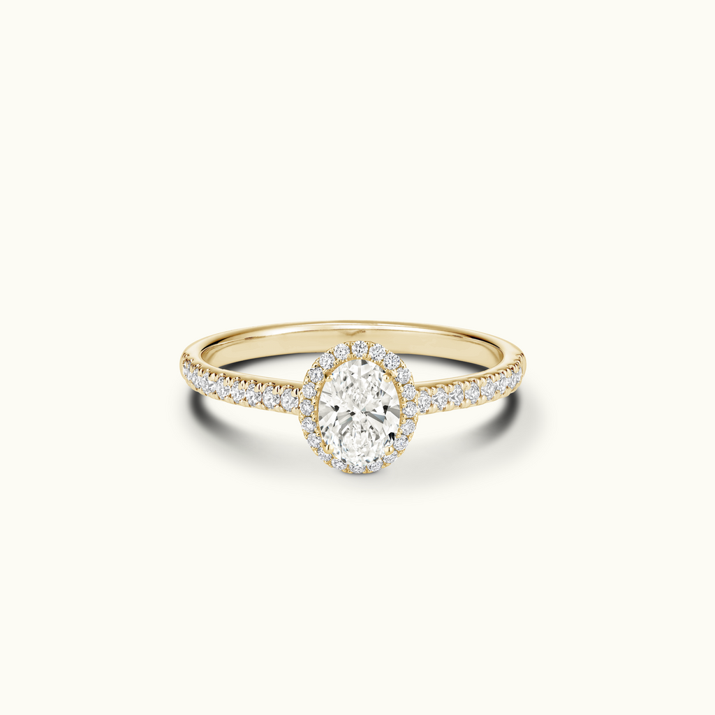 Jewellers District's Diamond Halo Engagement Ring with Diamond Bridge in 14k Yellow Gold, Oval