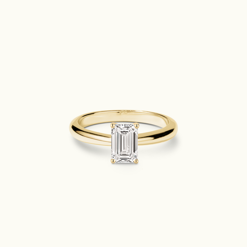 Jewellers District's Diamond Engagement Ring with Tapered Band in 14k Yellow Gold, Emerald