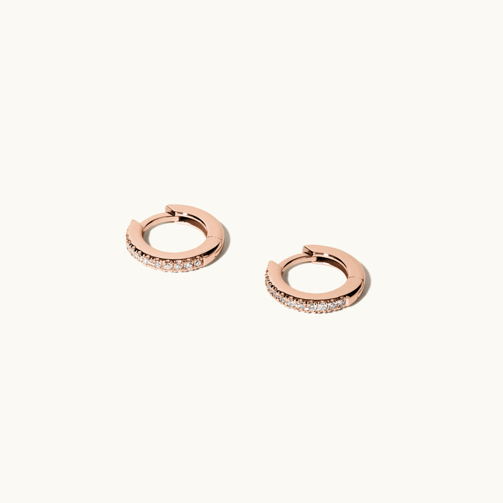 Angled view of Jewellers District's Diamond Hoop Earrings in 14k Rose Gold