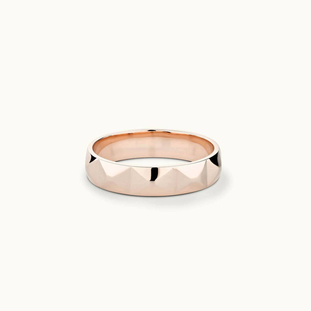 Face view of Jewellers District's Faceted Wedding Ring in 14k Rose Gold