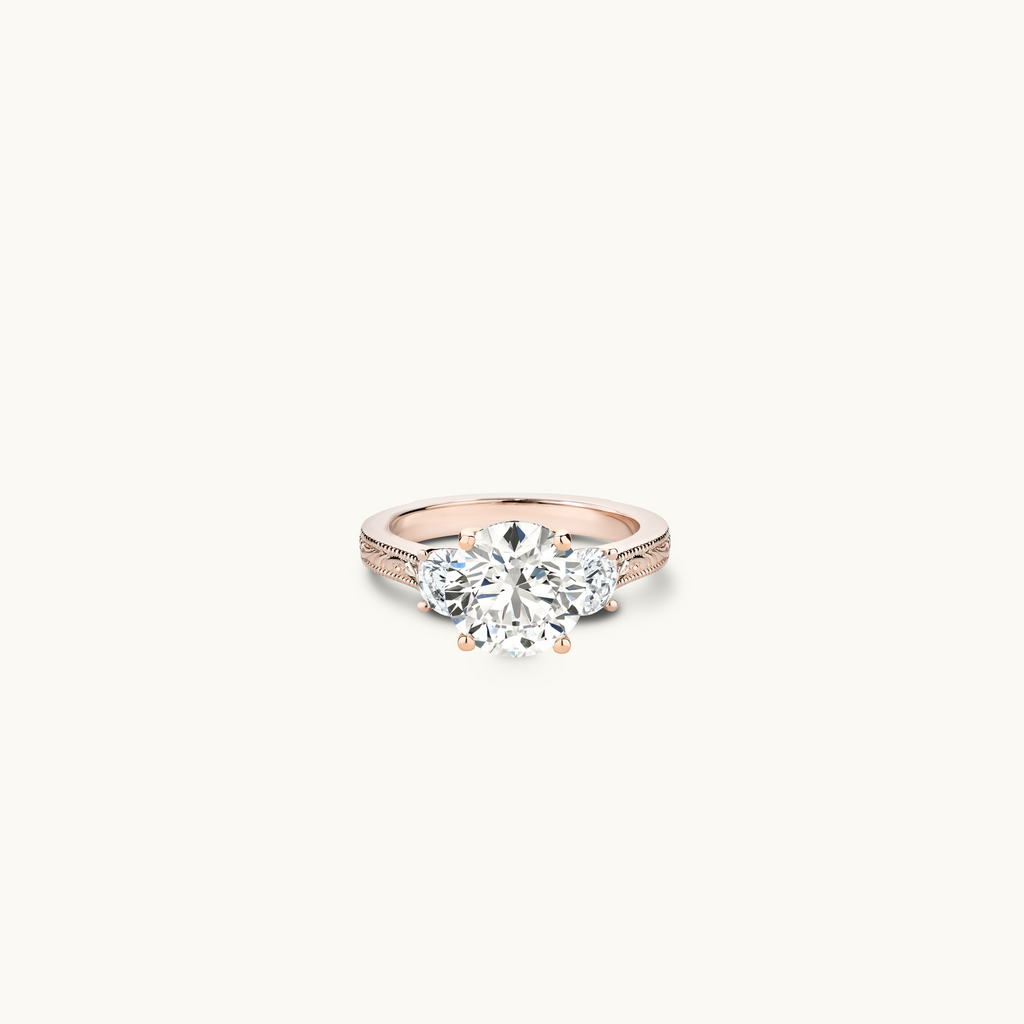 Jewellers District's Vintage Three-Stone Engagement Ring in 14k Rose Gold, Round