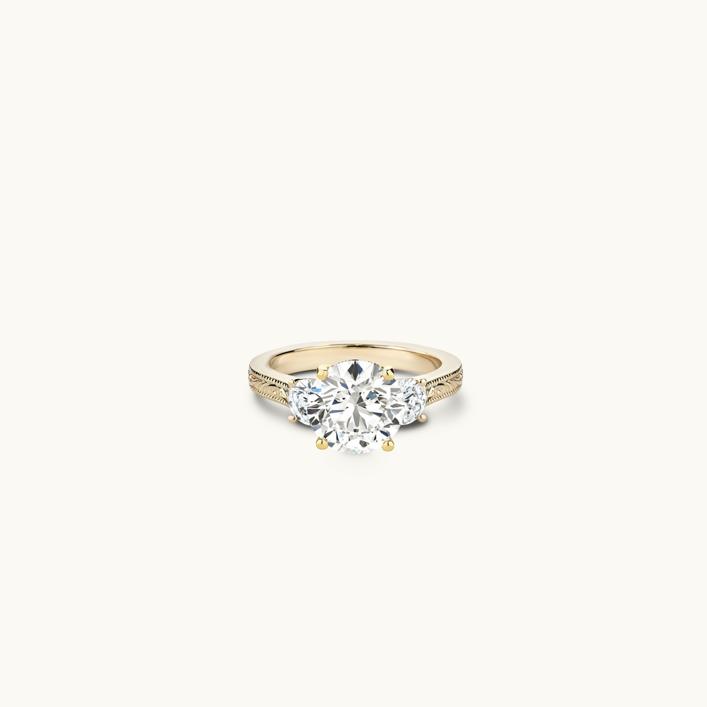 Jewellers District's Vintage Three-Stone Engagement Ring in 14k Yellow Gold, Round