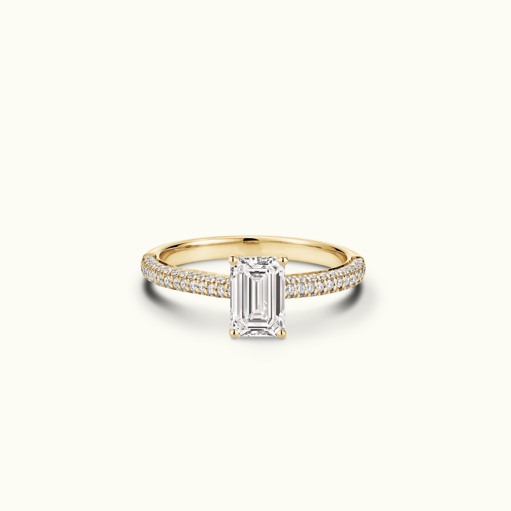 Jewellers District's Diamond Engagement Ring with Signature Knot-Basket and Micropavé Band in 14k Yellow Gold, Emerald