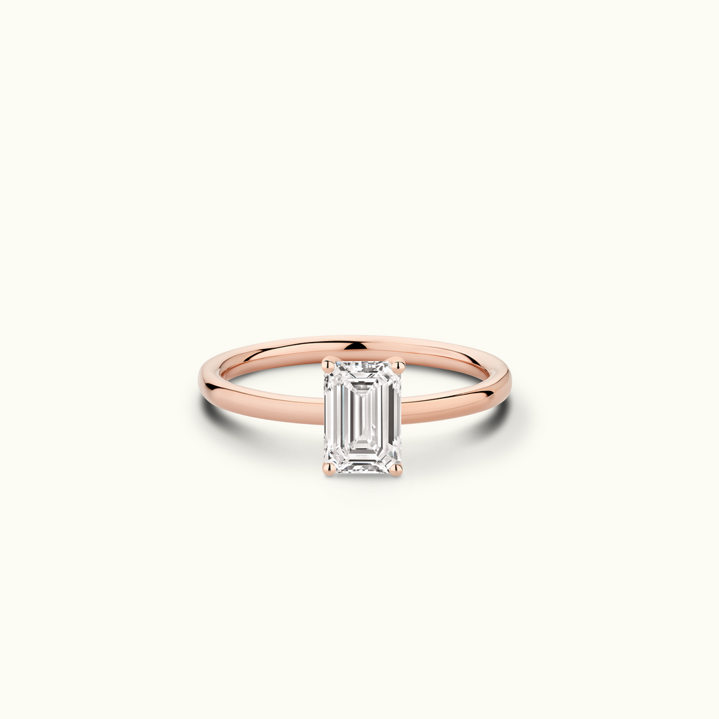 Jewellers District's Solitaire Diamond Engagement Ring with Signature Knot-Basket in 14k Rose Gold, Emerald