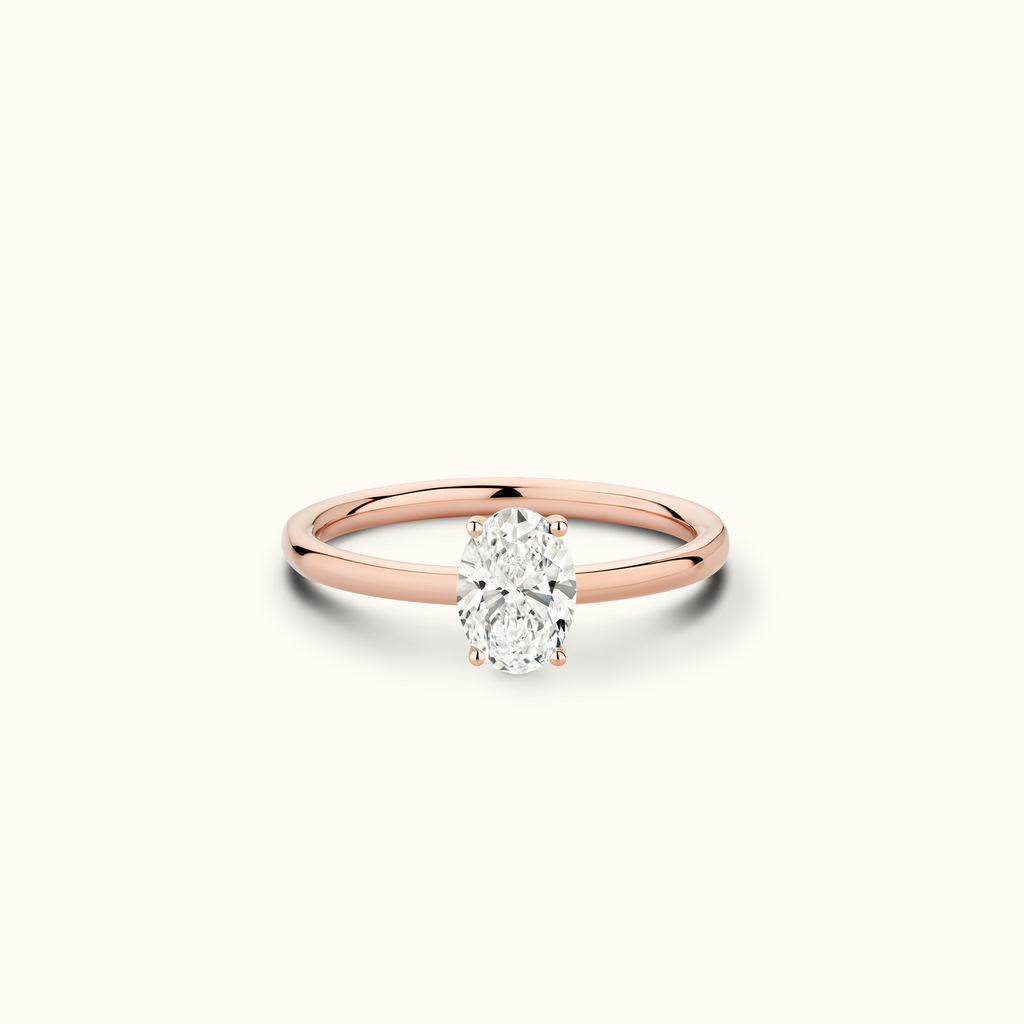 Jewellers District's Solitaire Diamond Engagement Ring with Signature Knot-Basket in 14k Rose Gold, Oval