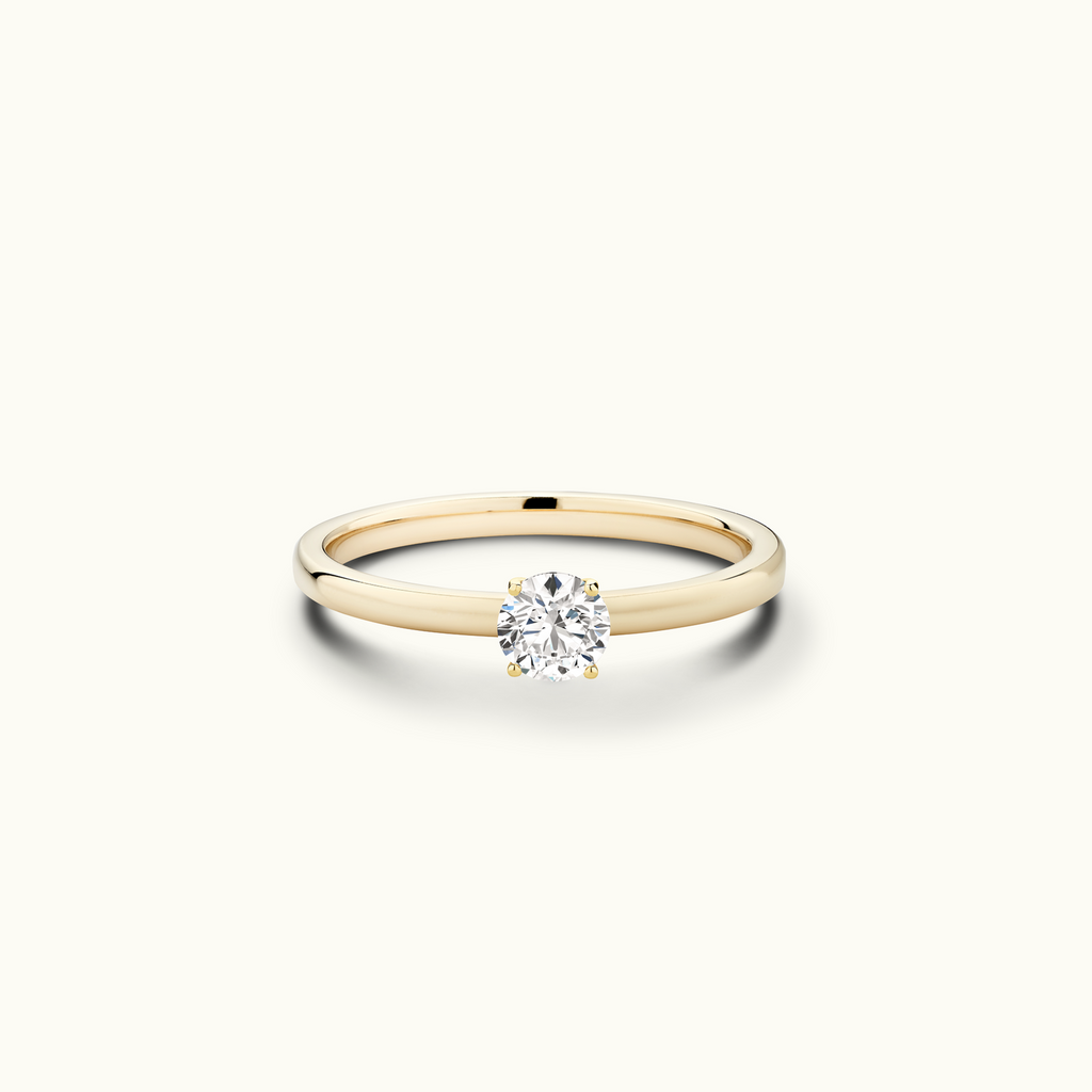 Jewellers District's Diamond Engagement Ring with Signature Knot-Basket and Accent Diamonds in 14k Yellow Gold, Round