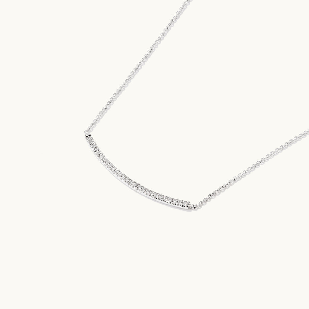 Profile view of Jewellers District's Curved Diamond Bar Necklace in 14k White Gold