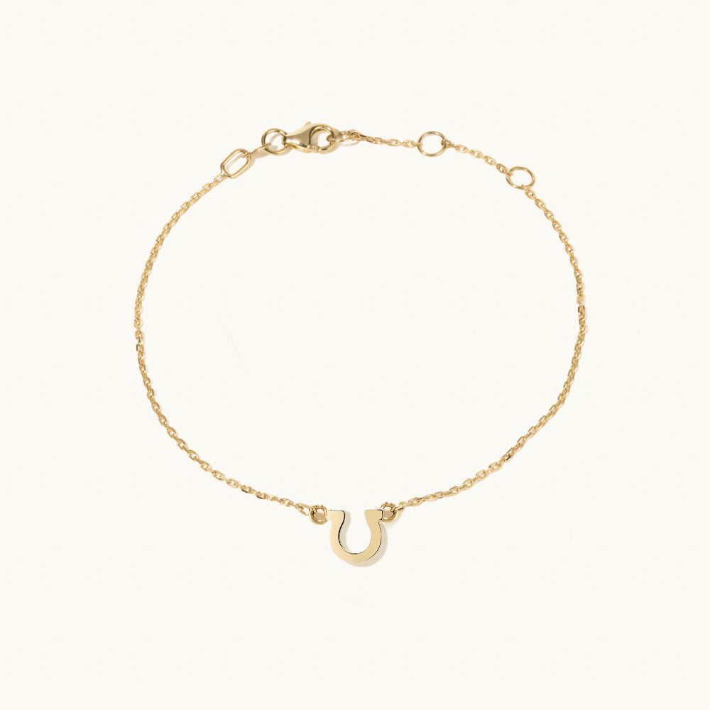 Face view of Jewellers District's Petite Gold Horseshoe Charm Bracelet in 14k Yellow Gold