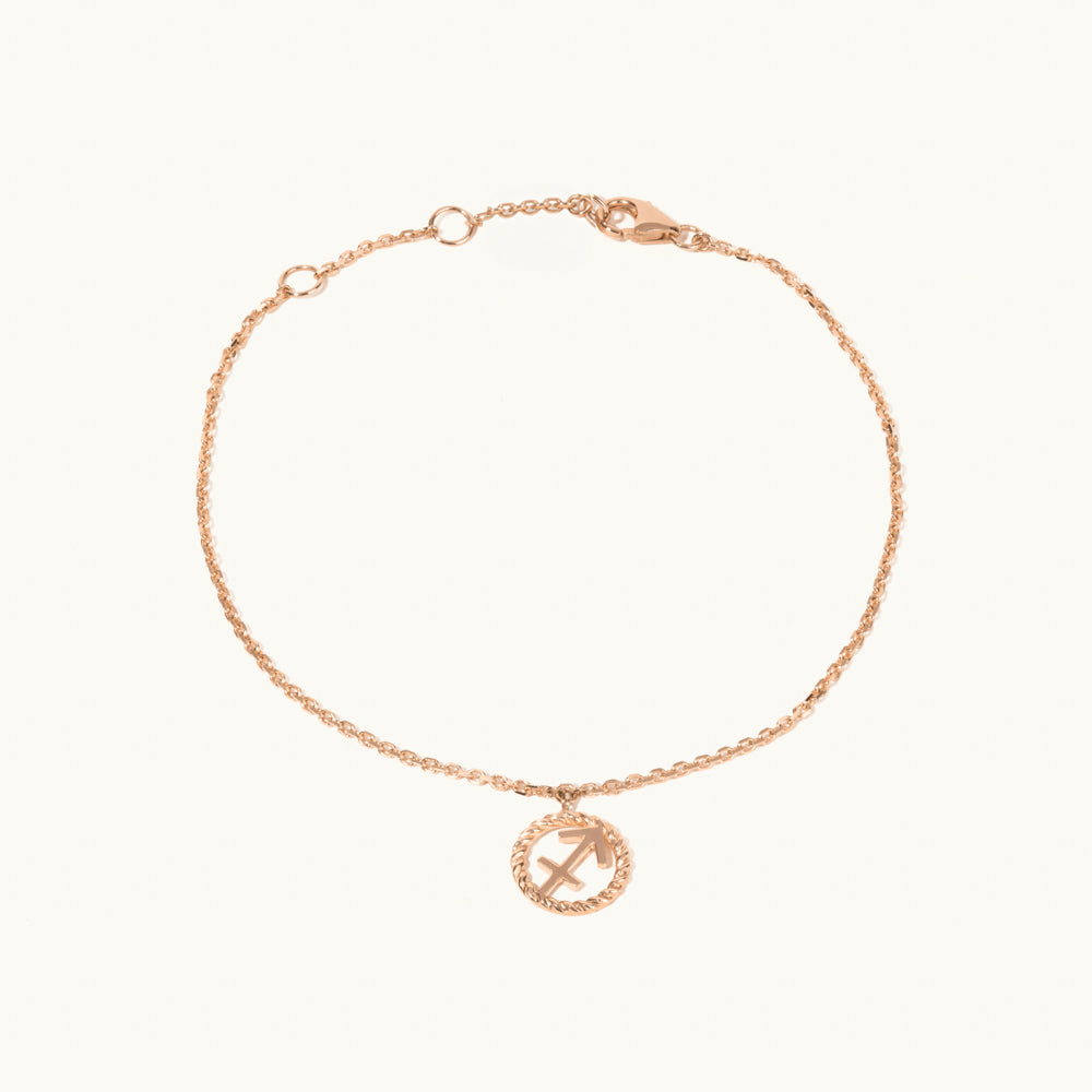 Model wearing Jewellers District's Gold Zodiac Charm Bracelet: Sagittarius in 14k Rose Gold