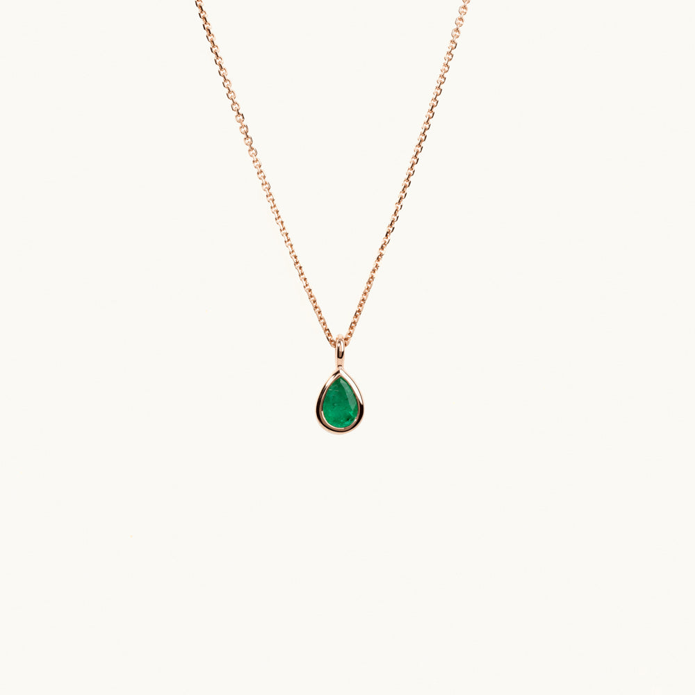 Face view of Jewellers District's Bezel Set Pear-Cut Emerald Pendant Necklace in 14k Rose Gold