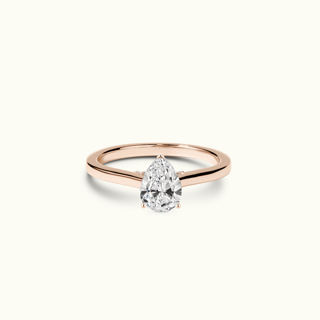 Jewellers District's Six-Prong Diamond Engagement Ring with Diamond Bridge in 14k Rose Gold, Pear