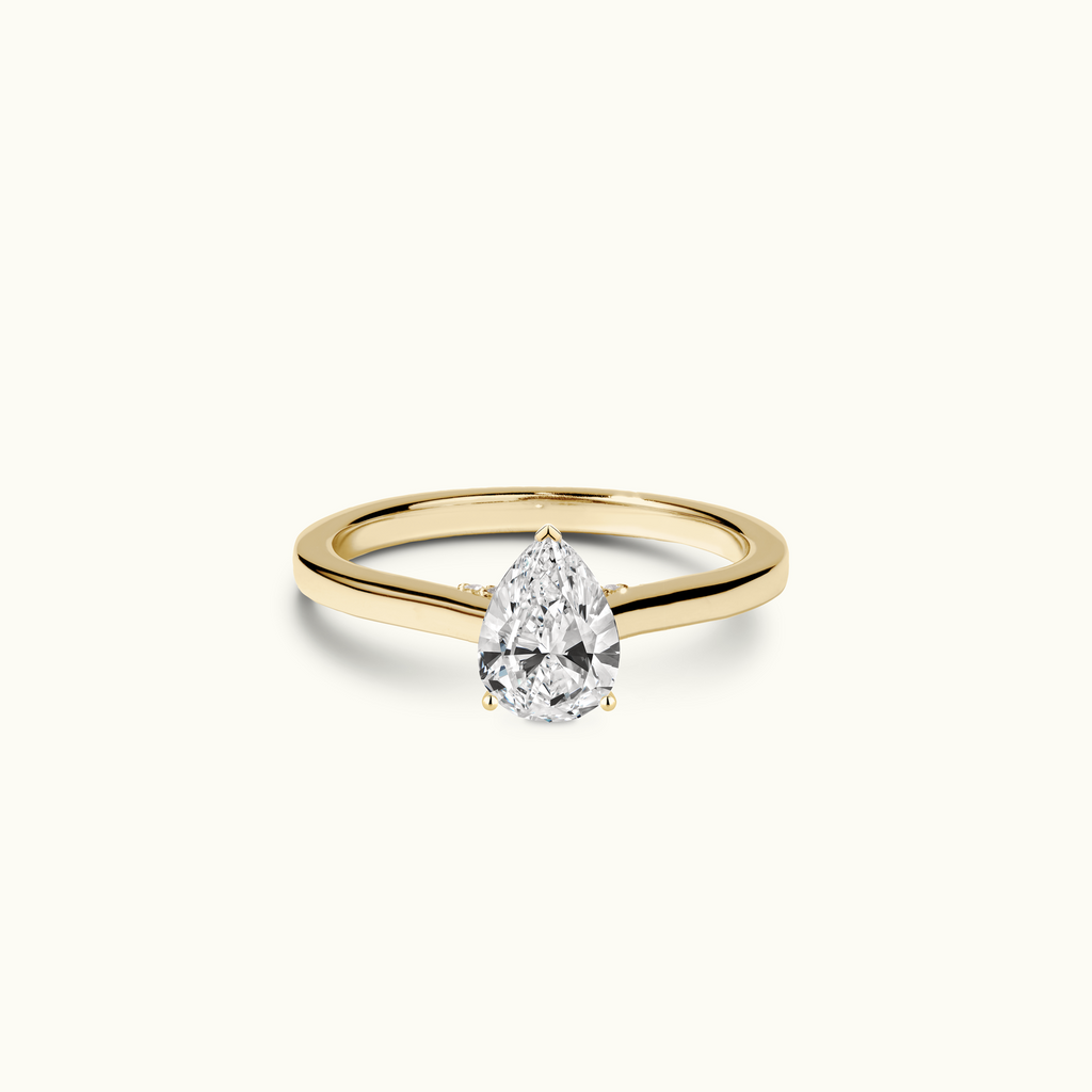 Jewellers District's Six-Prong Diamond Engagement Ring with Diamond Bridge in 14k Yellow Gold, Pear