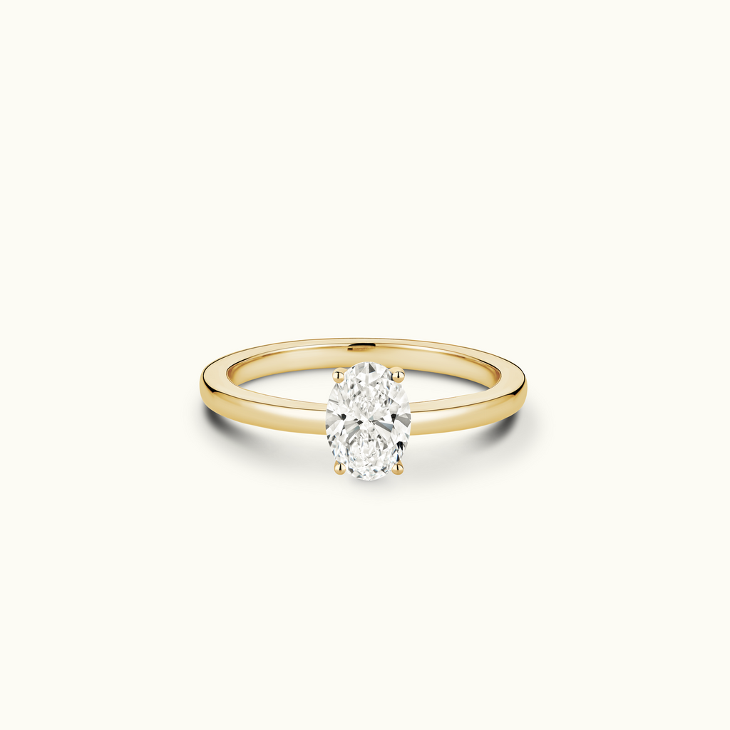 Jewellers District's Diamond Engagement Ring with Signature Knot-Basket and Diamond Prongs in 14k Yellow Gold, Oval