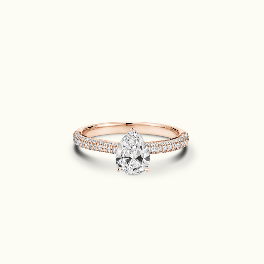 Jewellers District's Diamond Engagement Ring with Signature Knot-Basket and Micropavé Band in 14k Rose Gold, Pear