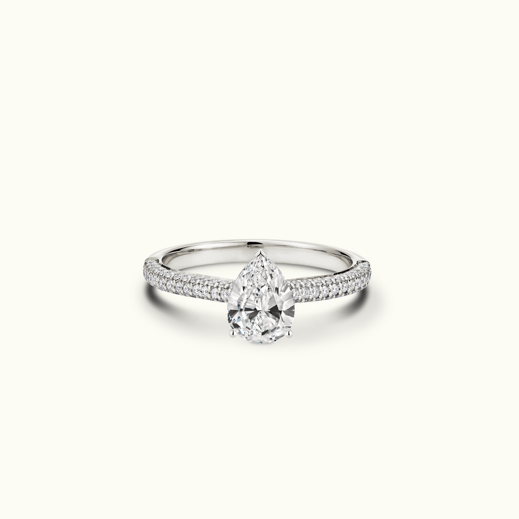 Jewellers District's Diamond Engagement Ring with Signature Knot-Basket and Micropavé Band in 14k White Gold, Pear