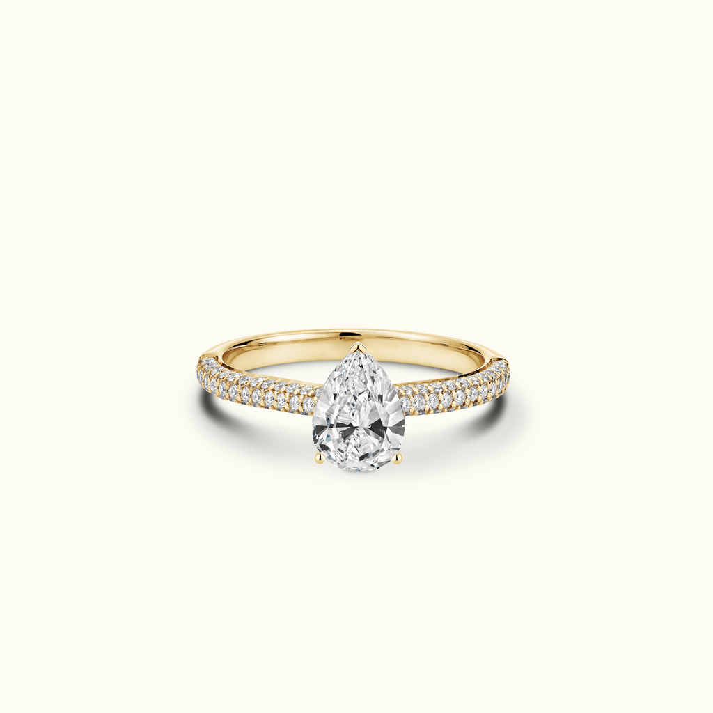 Jewellers District's Diamond Engagement Ring with Signature Knot-Basket and Micropavé Band in 14k Yellow Gold, Pear