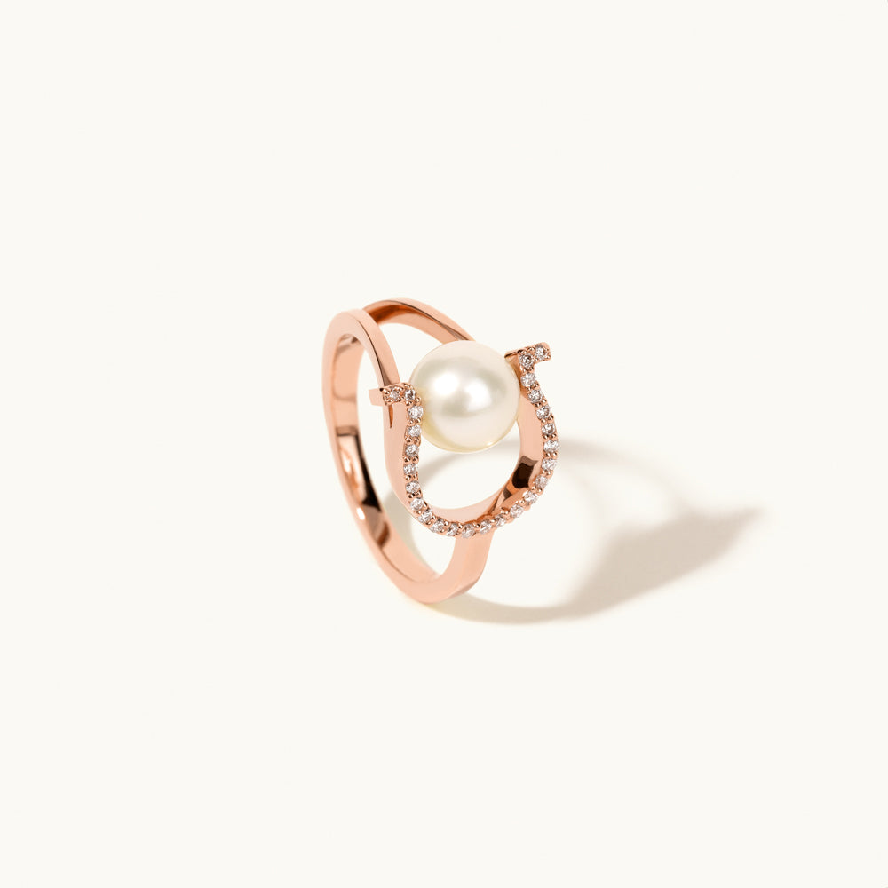 Angled view of Jewellers District's Horseshoe Freshwater Pearl Ring with Diamond Pavé in 14k Rose Gold