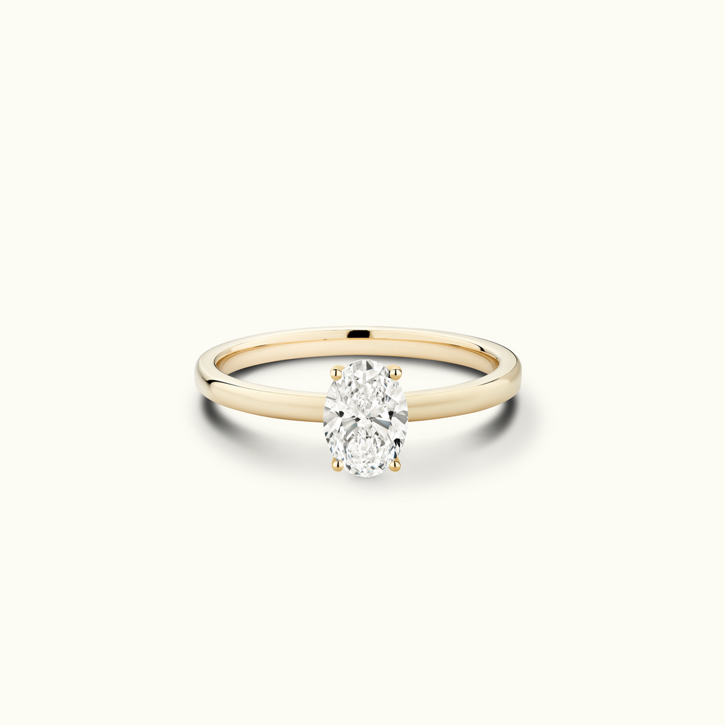 Jewellers District's Diamond Engagement Ring with Signature Knot-Basket and Accent Diamonds in 14k Yellow Gold, Oval