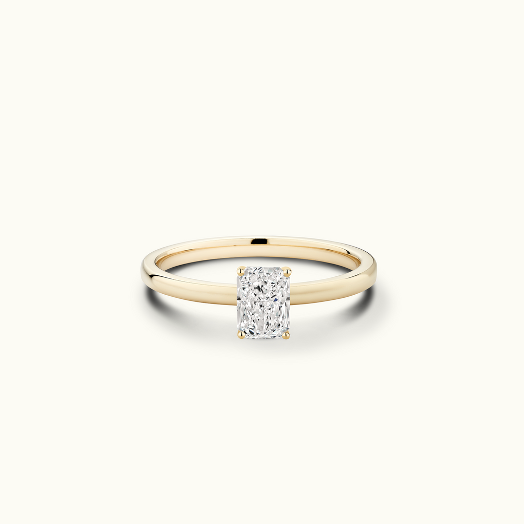 Jewellers District's Diamond Engagement Ring with Signature Knot-Basket and Accent Diamonds in 14k Yellow Gold, Radiant