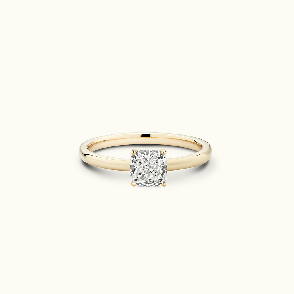 Jewellers District's Diamond Engagement Ring with Signature Knot-Basket and Accent Diamonds in 14k Yellow Gold, Cushion