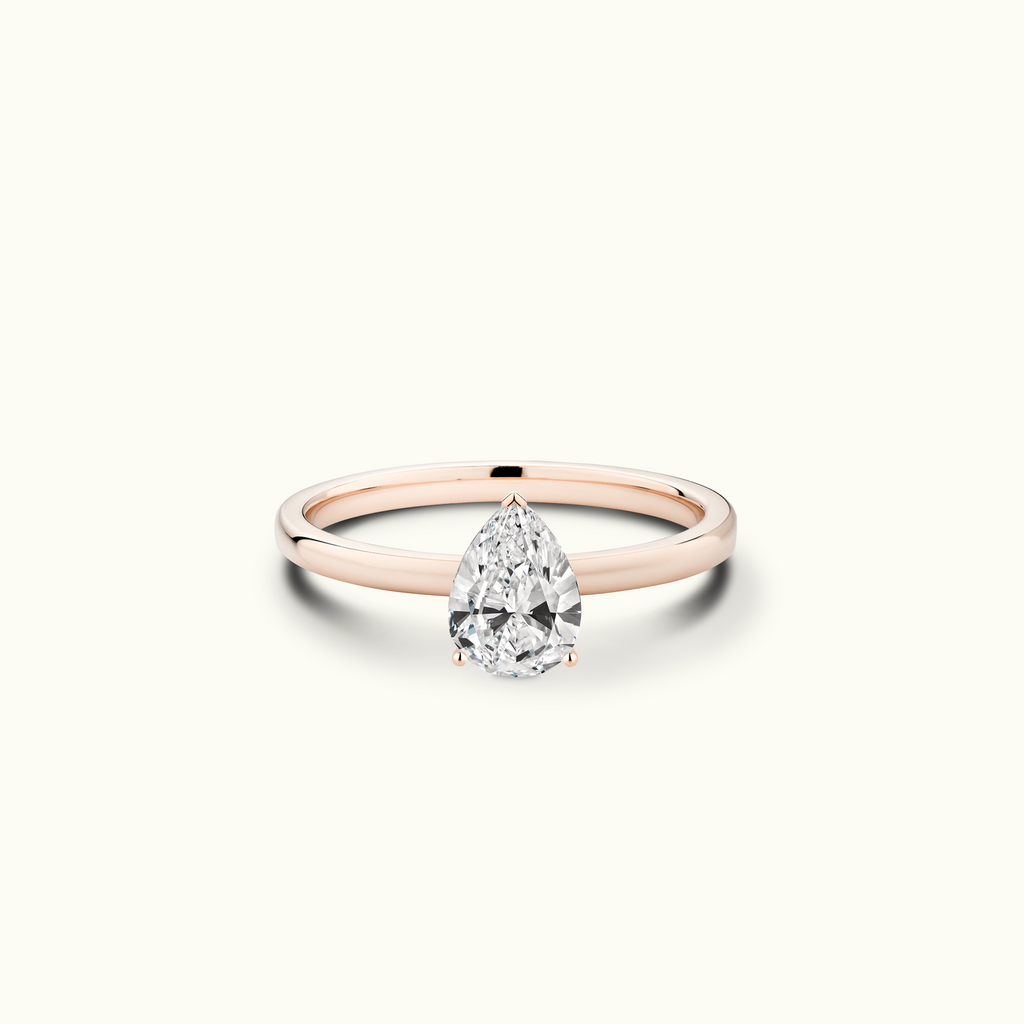 Jewellers District's Diamond Engagement Ring with Signature Knot-Basket and Accent Diamonds in 14k Rose Gold, Pear