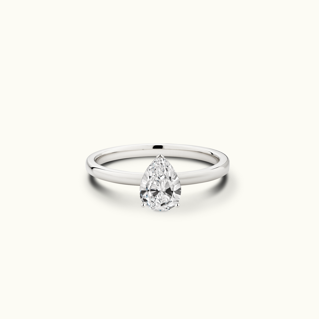 Jewellers District's Diamond Engagement Ring with Signature Knot-Basket and Accent Diamonds in 14k White Gold, Pear