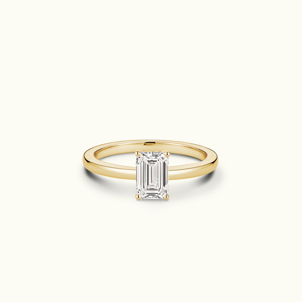 Jewellers District's Diamond Engagement Ring with Signature Knot-Basket and Diamond Prongs in 14k Yellow Gold, Emerald