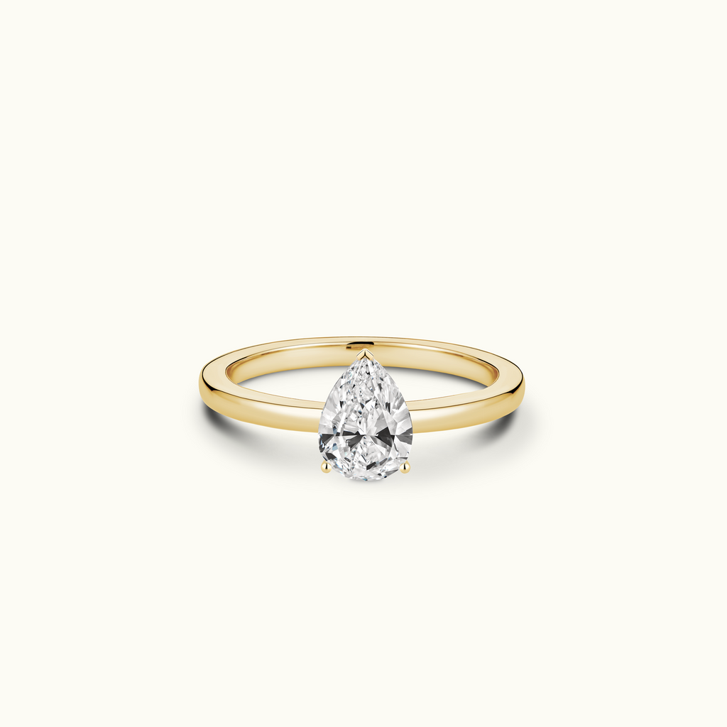 Jewellers District's Diamond Engagement Ring with Signature Knot-Basket and Diamond Prongs in 14k Yellow Gold, Pear