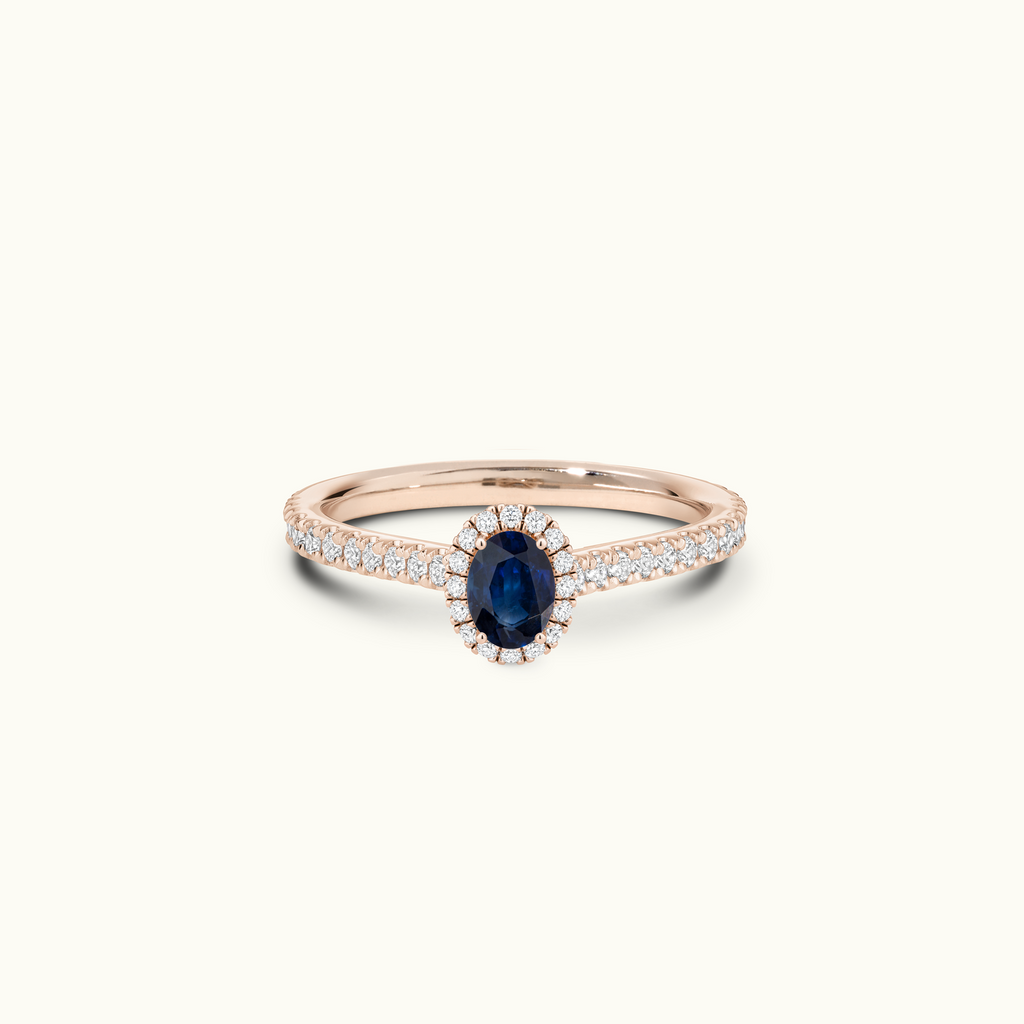 Jewellers District's Cathedral-Setting Royal Sapphire Halo Engagement Ring with Diamond Band in 14k Rose Gold, Oval