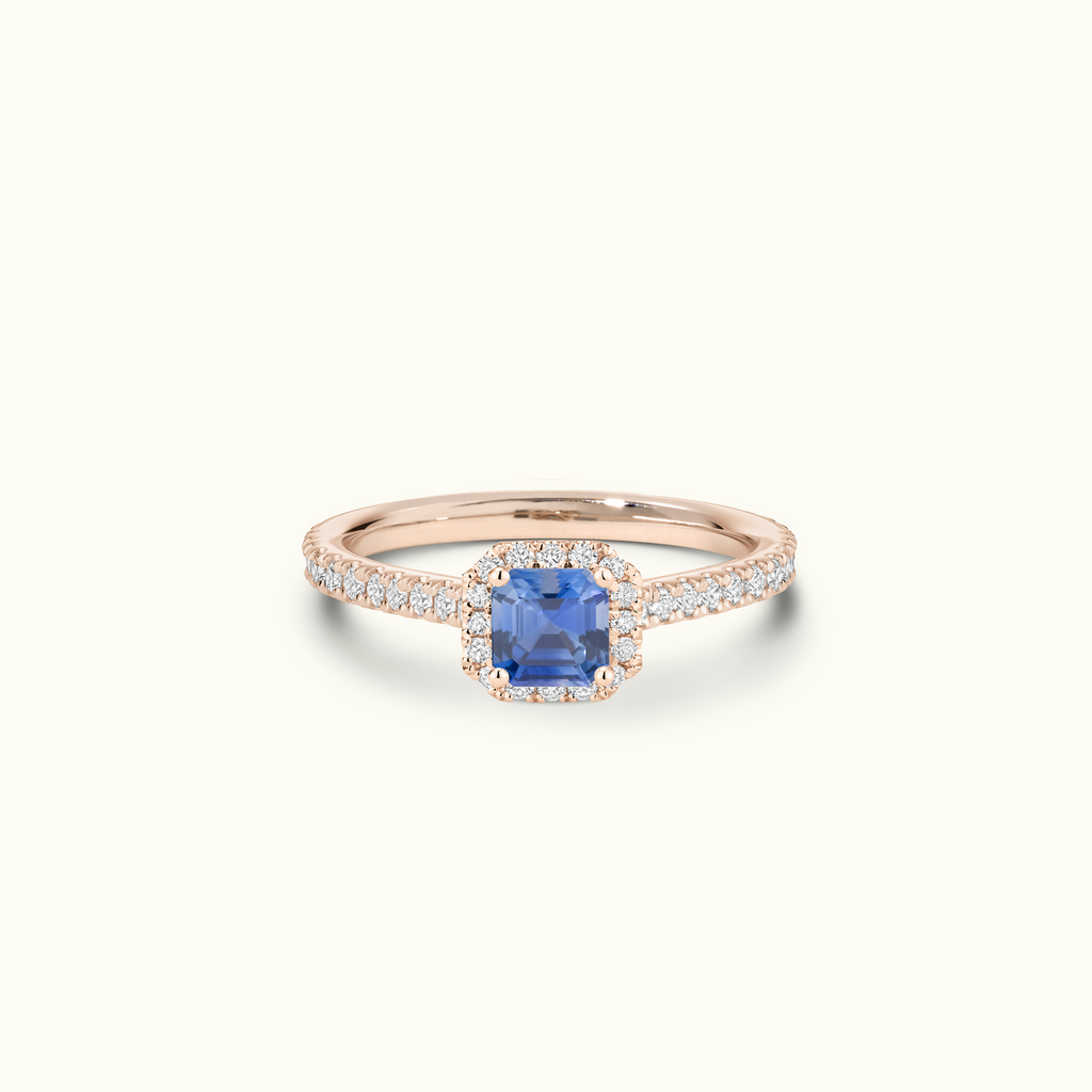 Jewellers District's Cathedral-Setting Royal Sapphire Halo Engagement Ring with Diamond Band in 14k Rose Gold, Asscher