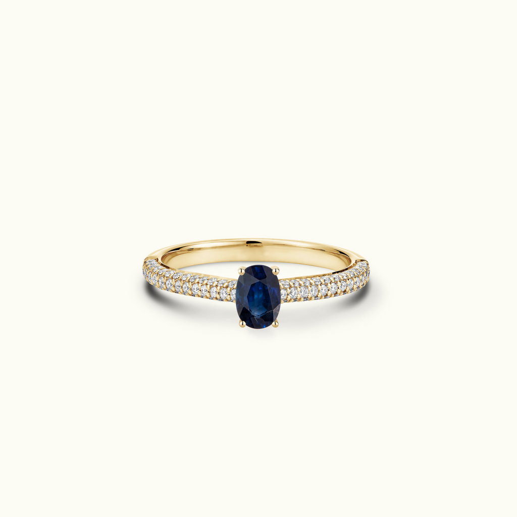 Jewellers District's Royal Sapphire Engagement Ring with Signature Knot-Basket and Micropavé Band in 14k Yellow Gold, Oval