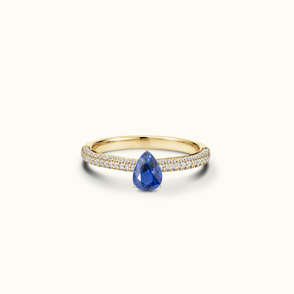 Jewellers District's Royal Sapphire Engagement Ring with Signature Knot-Basket and Micropavé Band in 14k Yellow Gold, Pear