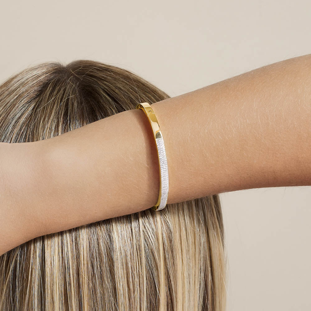 Model wearing Jewellers District's Diamond Pavé Gold Bangle in 14k Yellow Gold #2