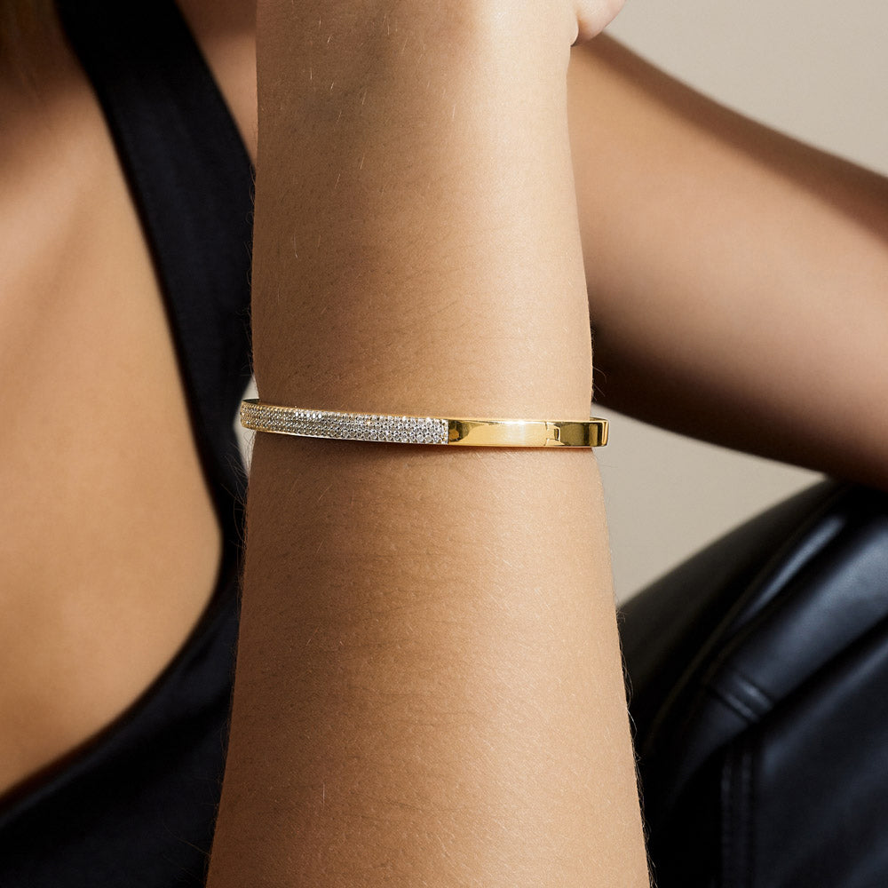 Model wearing Jewellers District's Diamond Pavé Gold Bangle in 14k Yellow Gold #4