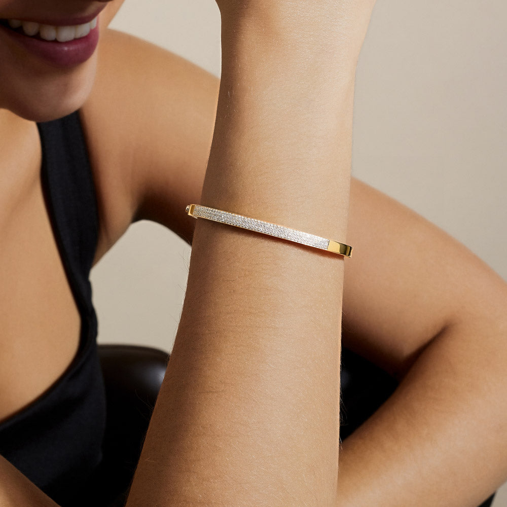 Model wearing Jewellers District's Diamond Pavé Gold Bangle in 14k Yellow Gold #5