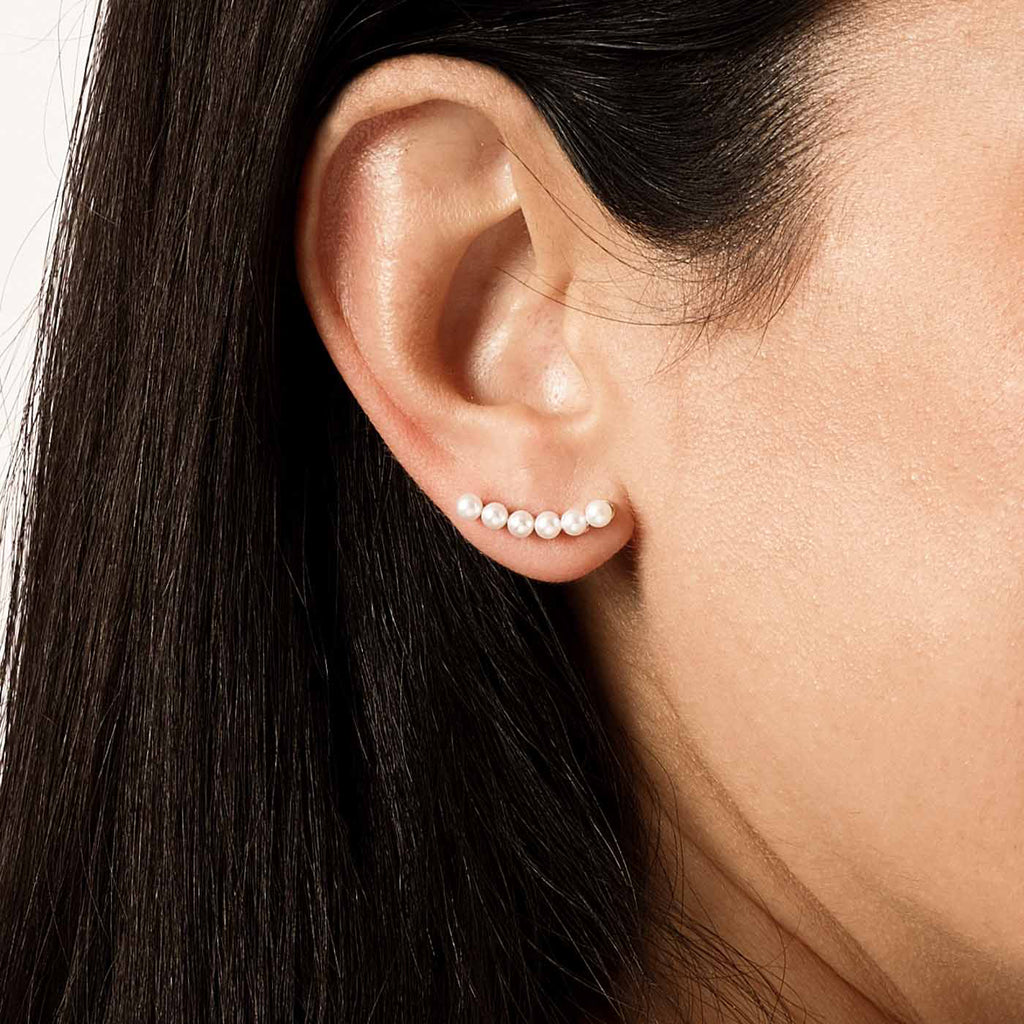 Model wearing Jewellers District's Freshwater Pearl Crawler Earrings in 10k Rose Gold #3