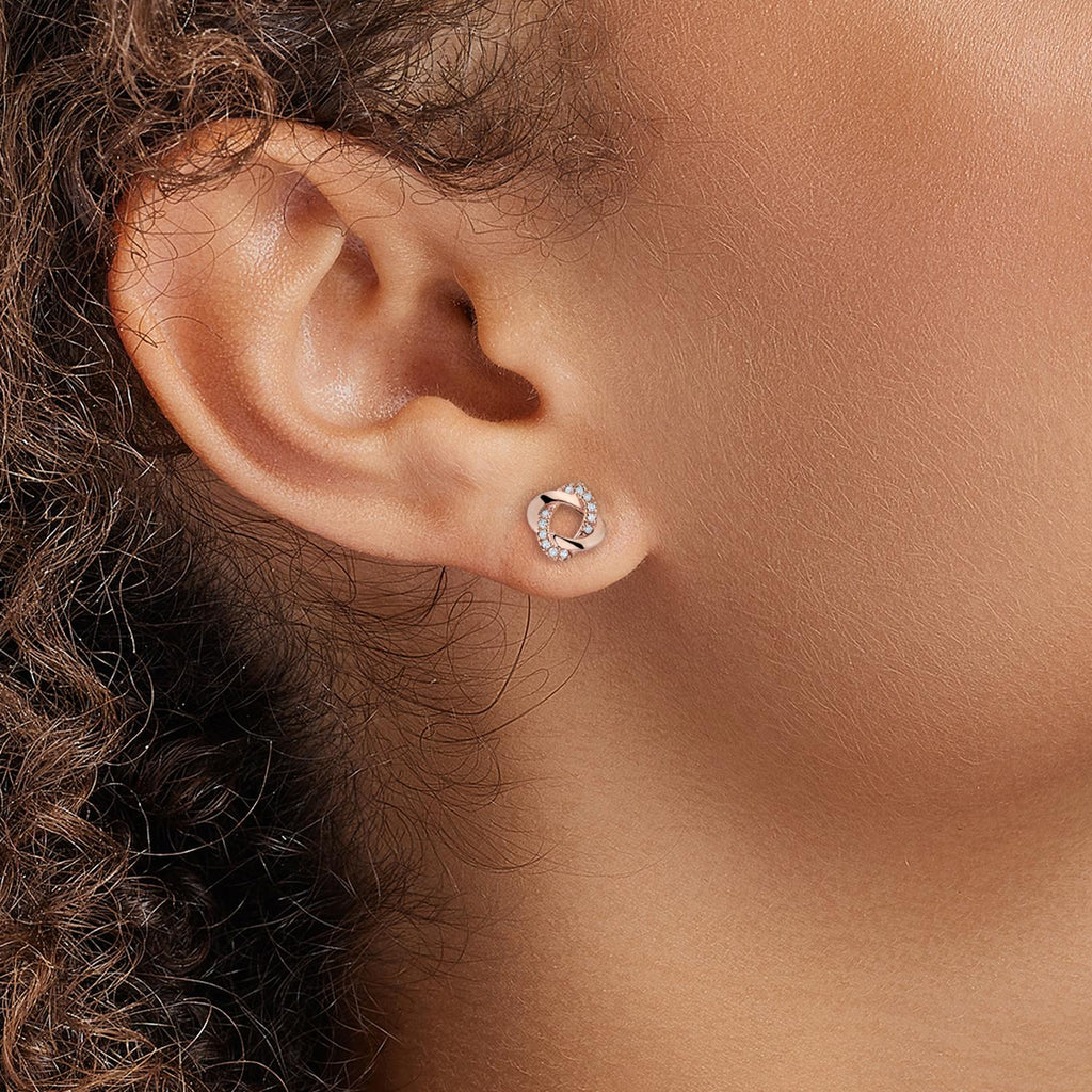 Model wearing Jewellers District's Twisted Diamond Pavé Studs in 10k Rose Gold