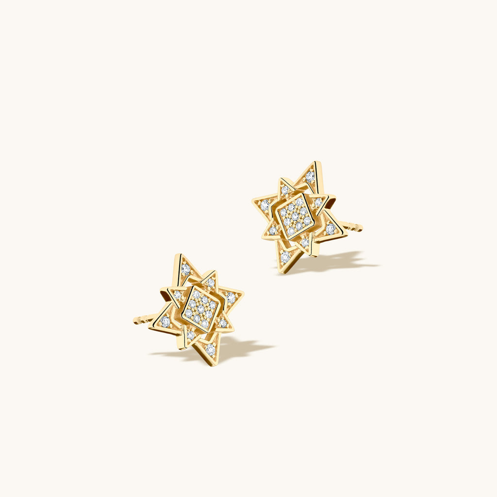 Angled view of Jewellers District's North Star Diamond Pavé Earrings in 10k Yellow Gold