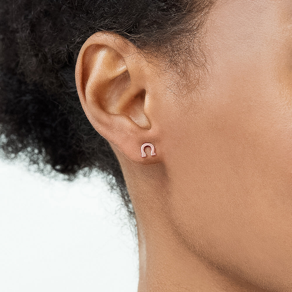 Model wearing Jewellers District's Gold Horseshoe Stud Earrings in 10k Rose Gold #4