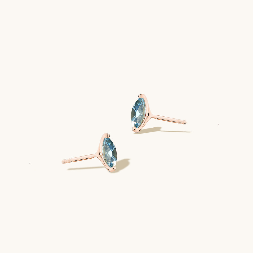 Angled view of Jewellers District's Marquise Cut Aquamarine Studs in 14k Rose Gold