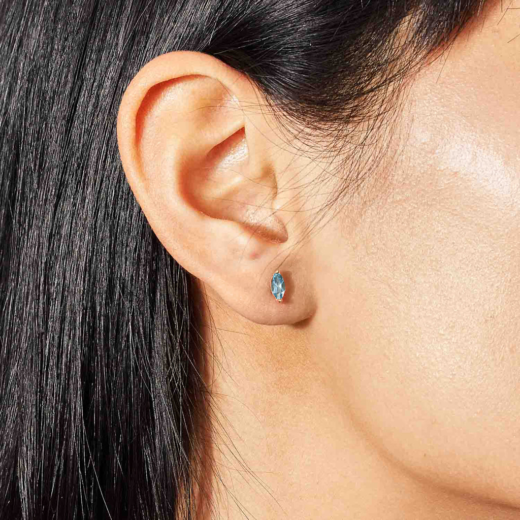 Model wearing Jewellers District's Marquise Cut Aquamarine Studs in 14k Rose Gold