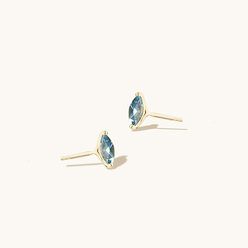 Angled view of Jewellers District's Marquise Cut Aquamarine Studs in 14k Yellow Gold