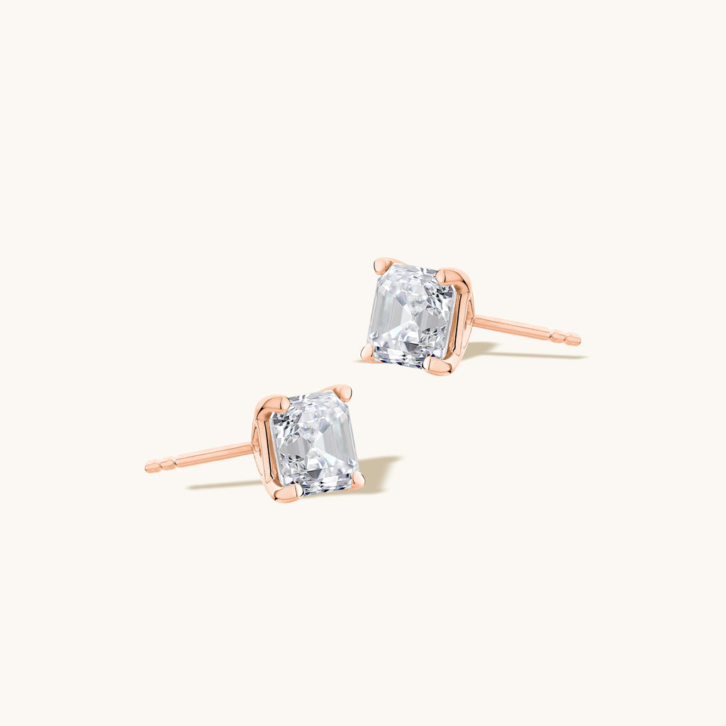 Angled view of Jewellers District's Asscher-Cut Diamond Stud Earrings in 14k Rose Gold, Lab-grown 1.40 ctw, VS2+/ F+