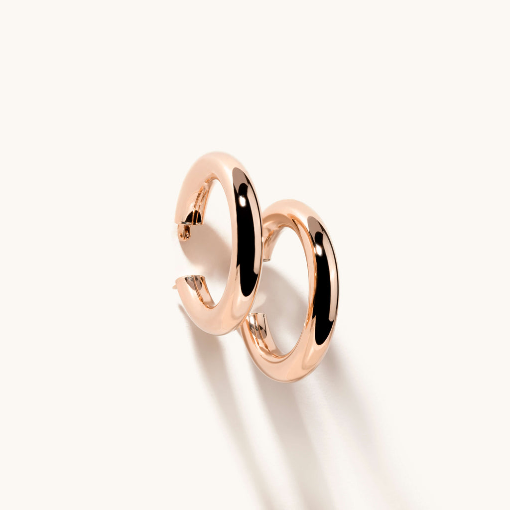 Angled view of Jewellers District's Bold Gold Hoop Earrings in 14k Rose Gold